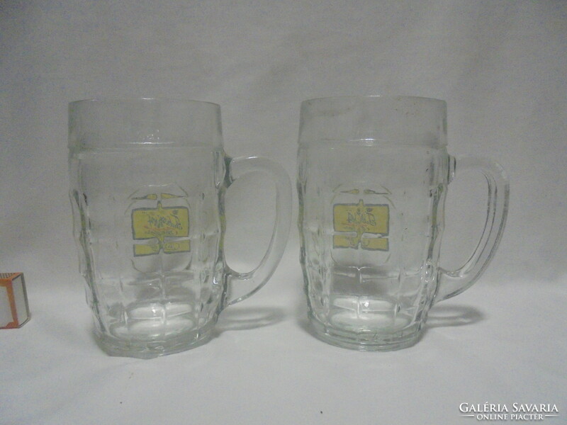 Two tuborg beer half-liter certified beer mugs together
