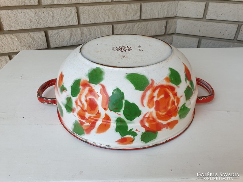 Old enameled bowl with a crown crest and rose pattern