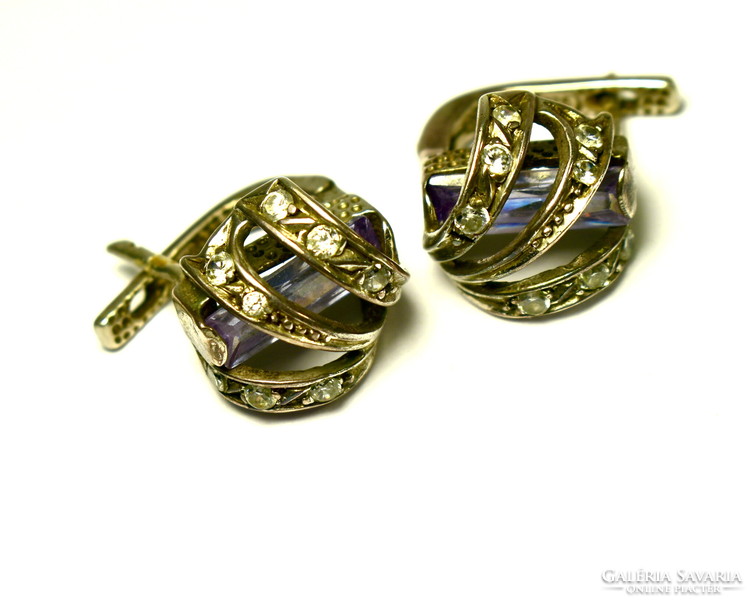 Decorative and spectacular silver earrings inlaid with small stones with a hidden larger polished stone