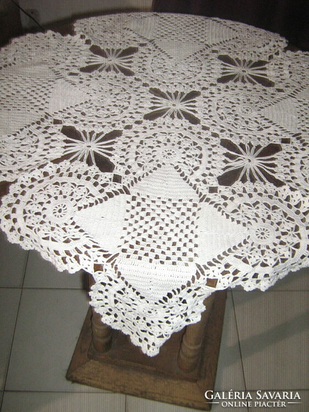 Beautiful white hand-crocheted antique lace tablecloth with a special shape