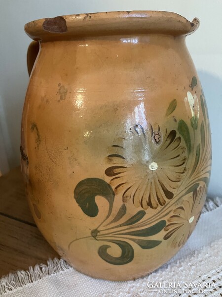 Large antique brown glazed earthenware pot with ceramic flower motif