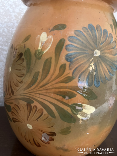 Large antique brown glazed earthenware pot with ceramic flower motif