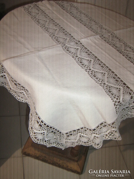 Beautiful white woven tablecloth with lace edges and inserts