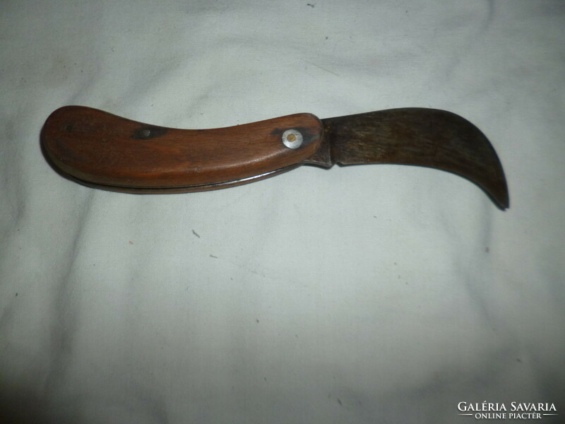 Old kacor knife with a large wooden handle