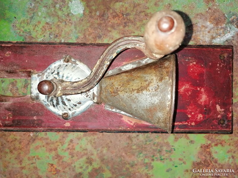 Rustic, antique, wall-mounted coffee grinder