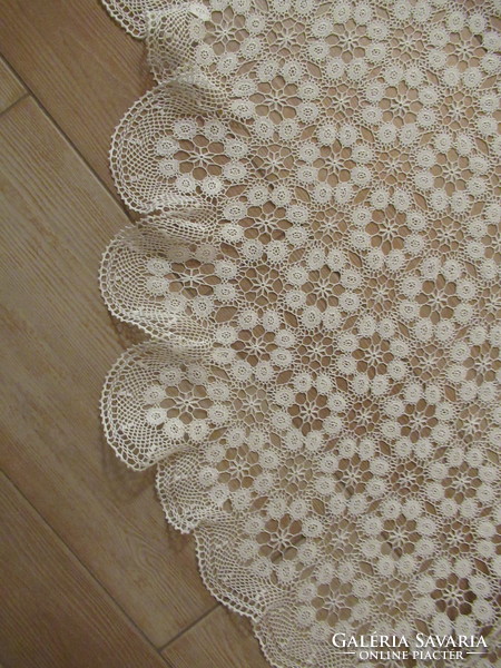 Delicate hand-crocheted piano tablecloth