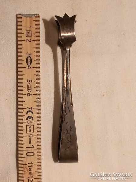 Silver sugar tongs, marked