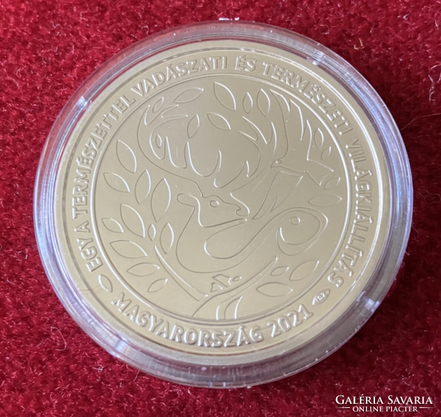 A HUF 2,000 coin of the hunting and nature world exhibition with nature