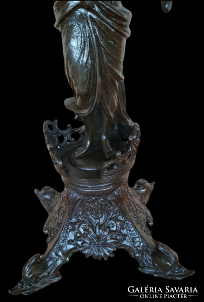 Female sculpture on antique table mirror