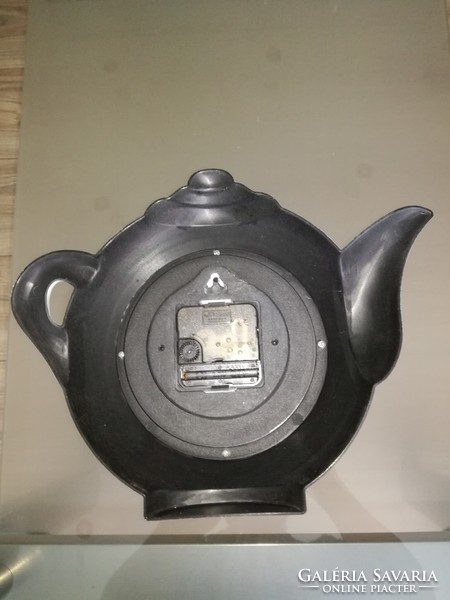 Kitchen wall clock in the shape of a teapot