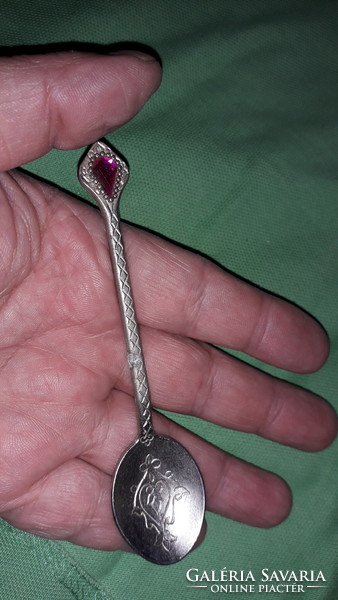 Antique silver-plated alpaca with red stone chiseled engraved pattern, like a decorative spoon according to the pictures