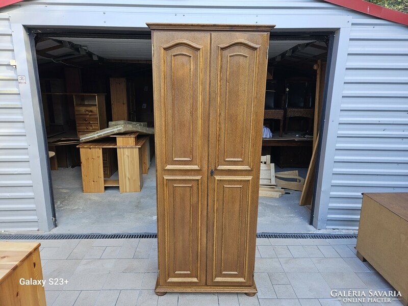 Oak double-door wardrobe in good condition for sale.