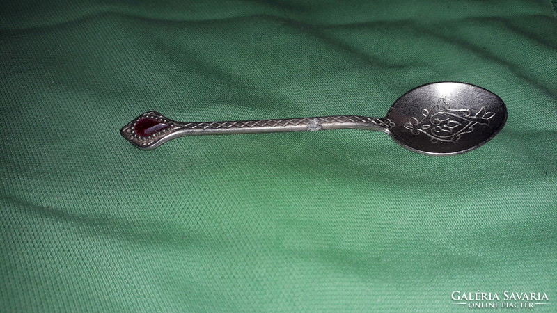 Antique silver-plated alpaca with red stone chiseled engraved pattern, like a decorative spoon according to the pictures