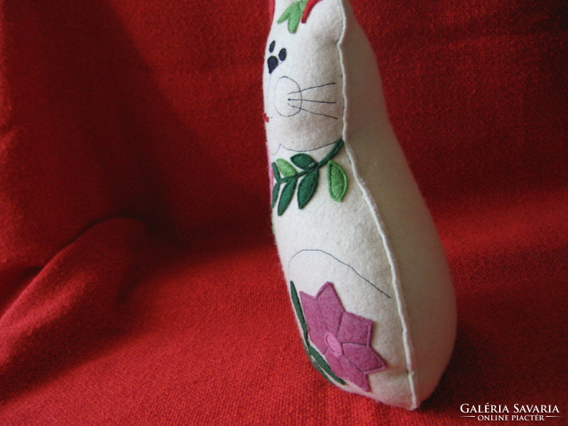 Handmade cat figurine with flower appliqué