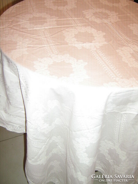 Beautiful white lacy edged floral damask tablecloth