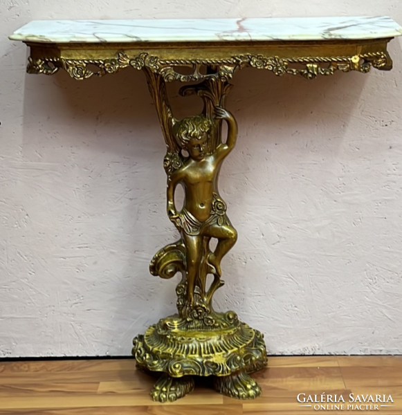 Antique style gold colored figural console table with mirror