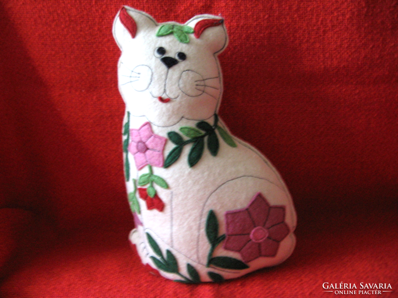 Handmade cat figurine with flower appliqué