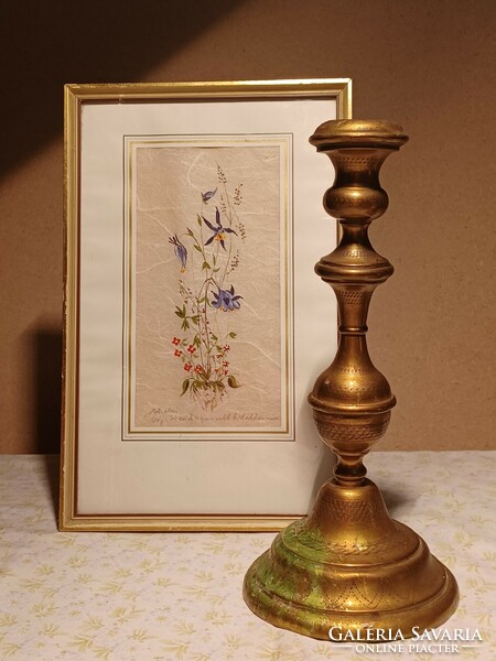 Old brass candle holder with a nice pattern