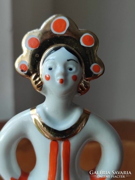 Charming folk dancing porcelain doll in Russian folk costume