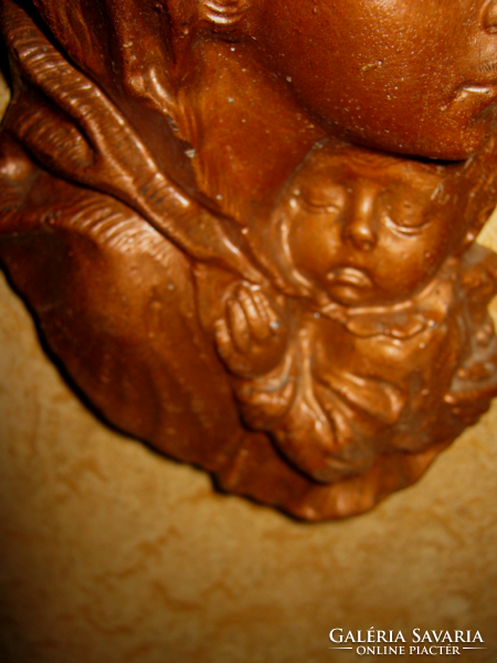 Handmade wax mary with the little one can be hung on the wall