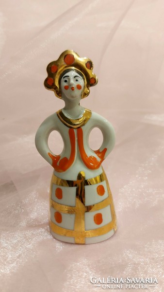 Porcelain girl dressed in Russian porcelain folk costume