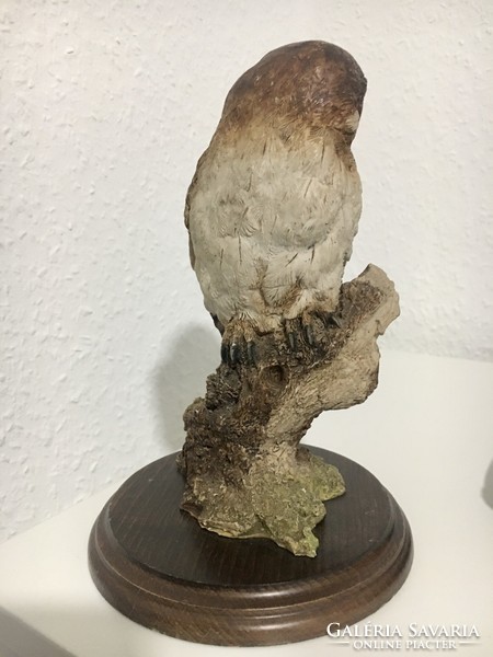 Vintage owl statue on wooden base