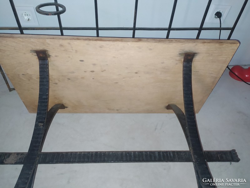 Table with wrought iron legs