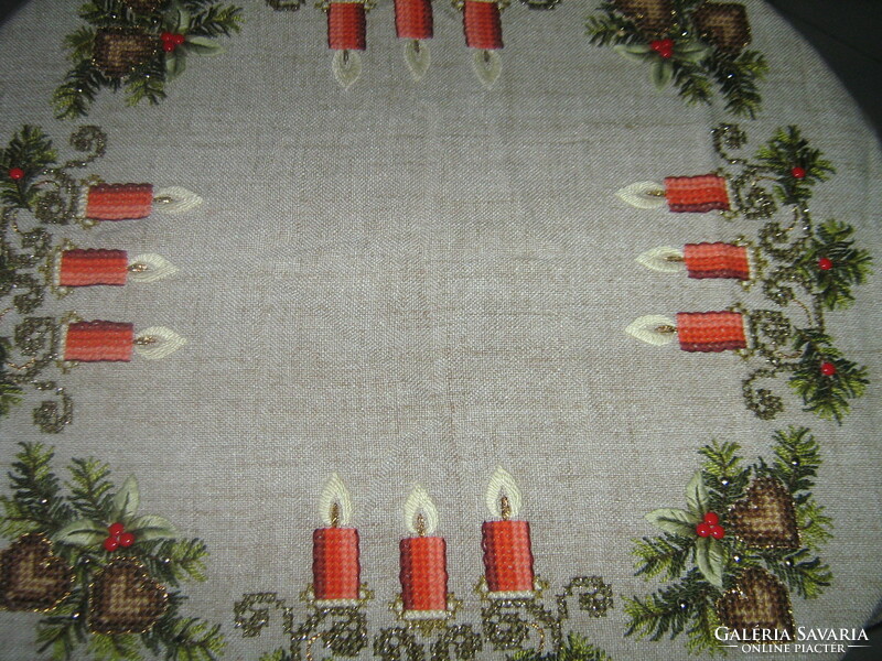 A dreamy Christmas tablecloth richly embroidered by hand with a lacy edge