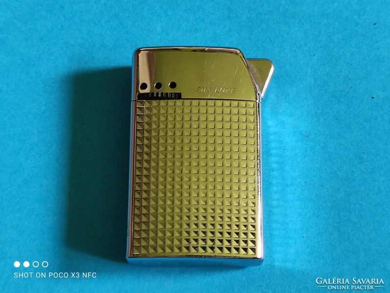 Vintage sim luxe lighter made in Austria with metal housing