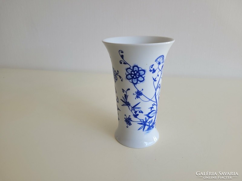 Old porcelain vase with blue flowers