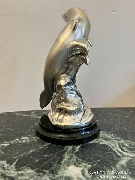 Silver dolphin statue