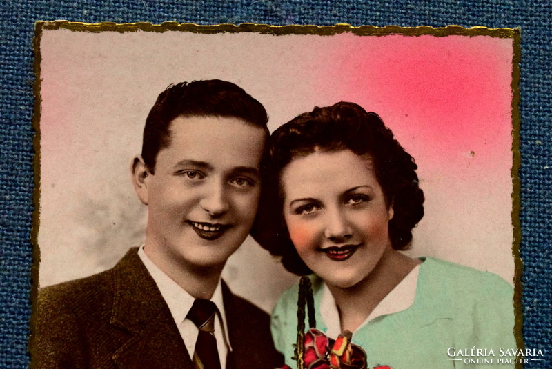 Old nostalgia photo postcard - couple in love with roses from 1942
