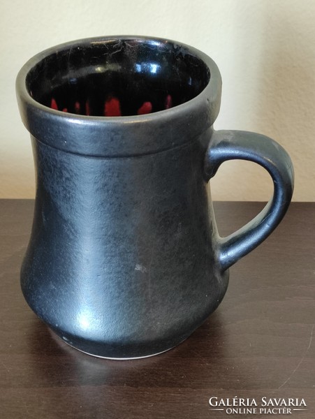 Retro industrial art ceramic jug with a pattern on the red and black inside