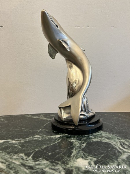 Silver dolphin statue