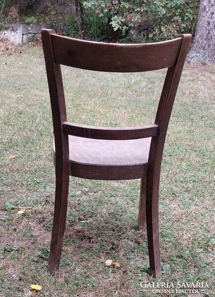 Antique art deco chair with a beautiful curved back, damaged, to be renovated