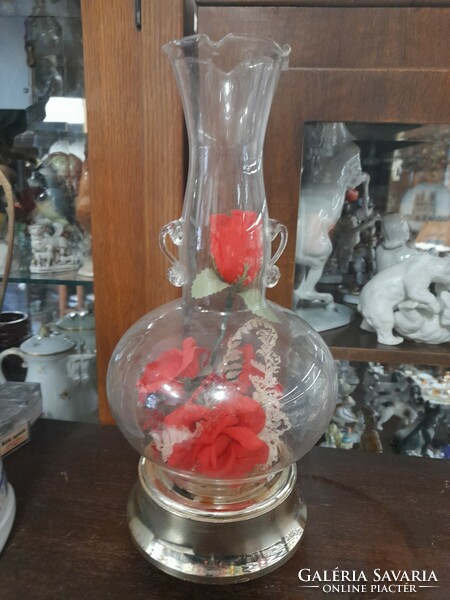 Retro lighting, musical, spinning rose bouquet table decoration, in a glass case.