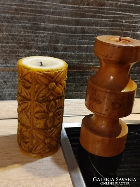Antique candle with carved wooden holder