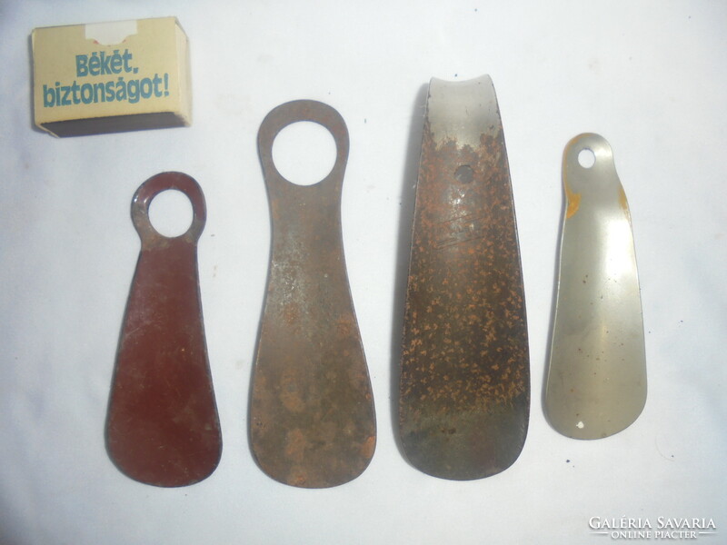 Four old metal shoe spoons together - one enameled