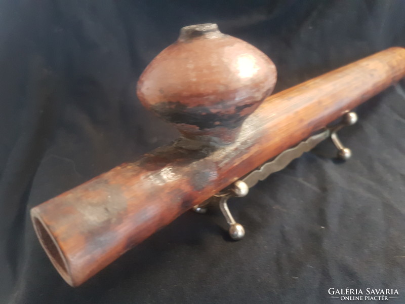 An opium pipe is an old piece, perhaps more than 100 years old