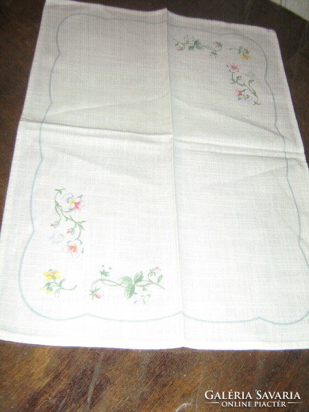 A charming floral napkin in a pastel shade
