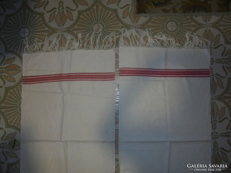 Two pieces of retro home-woven, fringed towels together