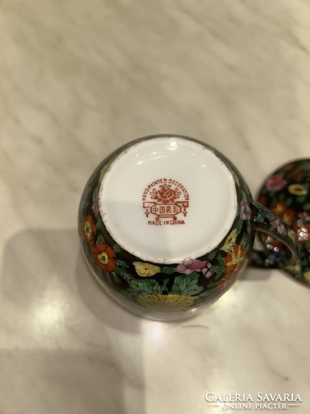 Hand-painted, lidded, gilded tea cup
