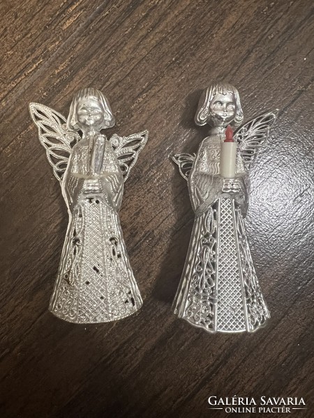 Two silver laced angel Christmas tree decorations are damaged
