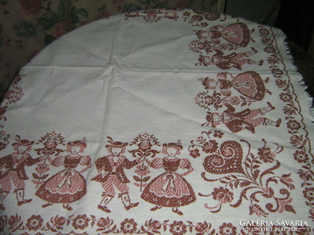 Beautiful vintage bavarian motif on an off-white background Tyrolean girl-boy with floral kind woven tablecloth