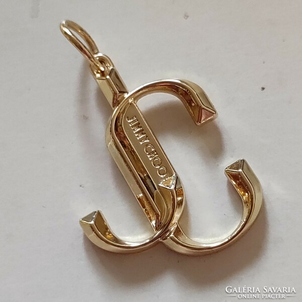 Original jimmy choo pendant worth 30,000.-