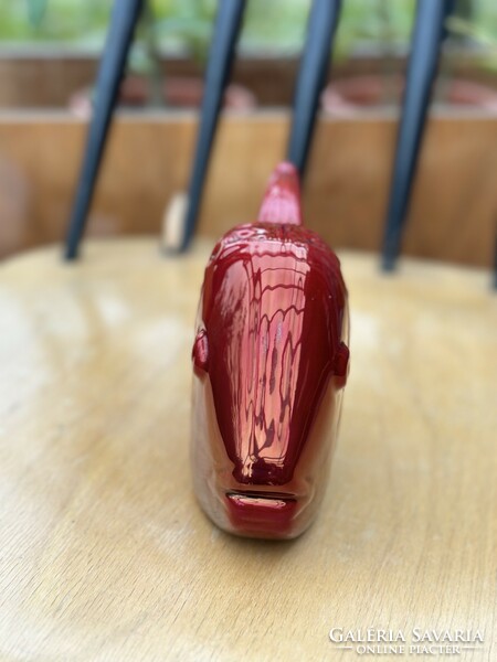 Zsolnay's oxblood-glazed fish with a curved tail, based on the designs of Palatine Judit. Very rare.