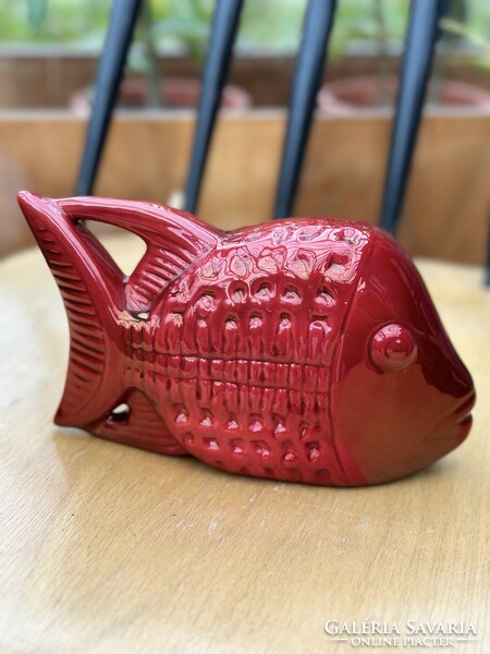 Zsolnay's oxblood-glazed fish with a curved tail, based on the designs of Palatine Judit. Very rare.