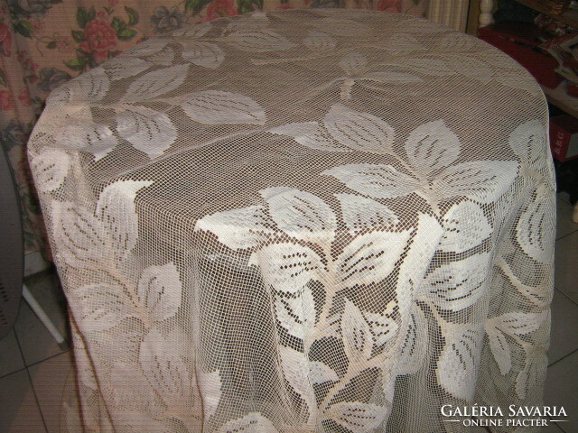 Beautiful huge ecru-white antique curtain with leaves