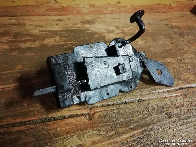 The lock is a smaller, forged piece, not keyed, but just a latch, so it is an old handle lock