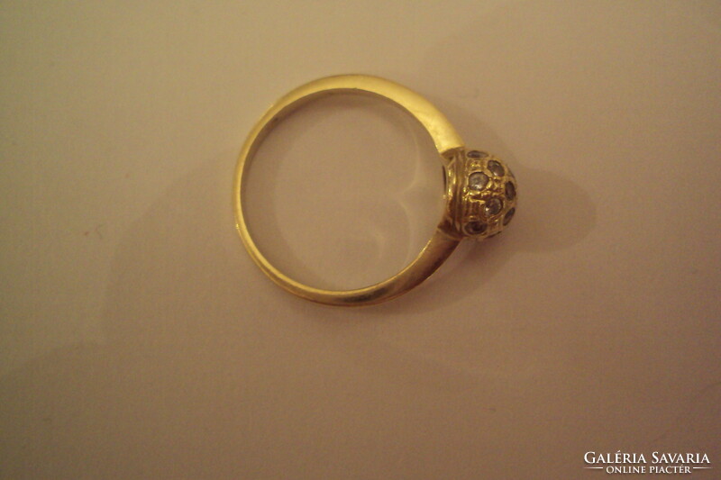 14 carat gold ring with grid spherical head, polished zirconia stones.